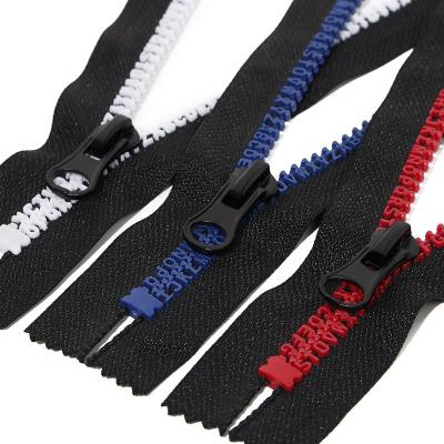 China Automatic lock wholesale price higher quality narrow end zippers colorful alphabet teeth vislon 5# resin zipper for backpack bag for sale