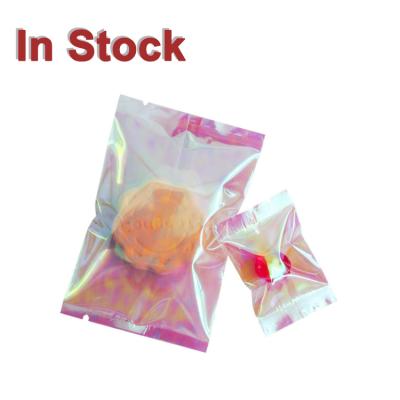 China Recyclable Heat Sealable Pink Translucent Plastic Flap Seal Pillow Holographic Packaging Bags for sale