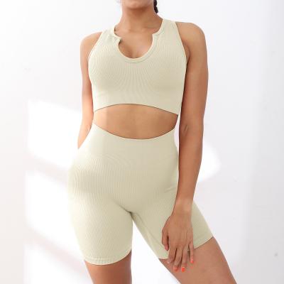 China New breathable elastic seamless tops knit V-neck sports yoga bra yoga suit running fitness pantsuit for women for sale