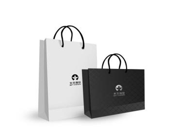 China Retail Store Shopping Printed Paper Bag With Handles , White Or Black Color for sale