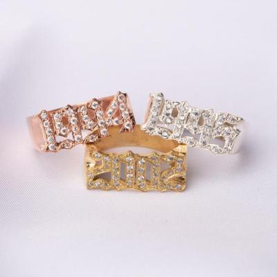 China Custom Made Gold Plated Ring Personalized FASHIONABLE Gothic Crystal Year Ring Two Color Name Ring for sale