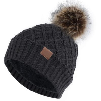 China breathable & Winter Warm Fleece Striped Skull Cap Beanie Pom Pom Beanie Hat Soft Cable Knit Faux Fur Women's Cuff Beanie Waterproof for sale