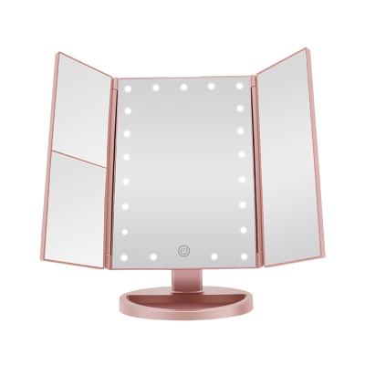 China Touch Screen Lit 22 Triple LED Lighted Vanity Makeup Mirror with 1x/2x/3x Magnification USB Charging 180 Degree Adjustable Stand for sale