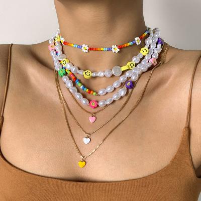 China New BOHEMIA Oil Drip Heart Shaped Pendants Necklaces Stacked Smiley Daisy Imitation Pearls Seed Bead Enamel Heart Chain Necklace Y2K for sale