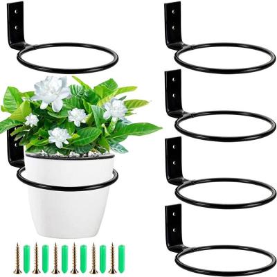 China Simple Trapezoidal Multi-Layer Indoor Outdoor Home Floor-Standing Balcony Rack Wrought Iron Living Room Flower Pot Shelf for sale