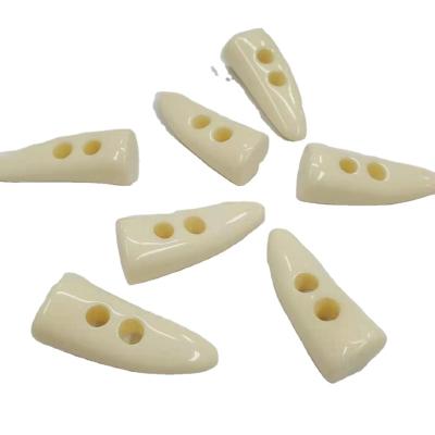 China Wholesale Good Quality Dry Cleaning White Horn Shape Two Holes Plastic Resin Horn Button For Coat for sale