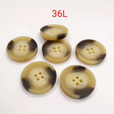 China High Quality Washable Resin 36L Custom Made Horn Button Fashion 4 Holes Flat Buttons For Clothes for sale