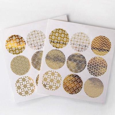 China Decorative Sticker Custom Kiss Cut Around Self Adhesive Paper Vinyl Gold Foil Hot Stamping Waterproof Security Seals Packaging Label Sticker for sale