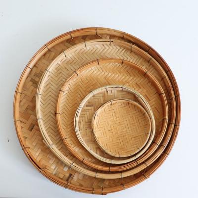 China Minimalist Vintage Woven Bamboo Basket Set Flat Round Winnowing Basket Tray Wall Hanging Native Tribal Boho Drying Decor for sale