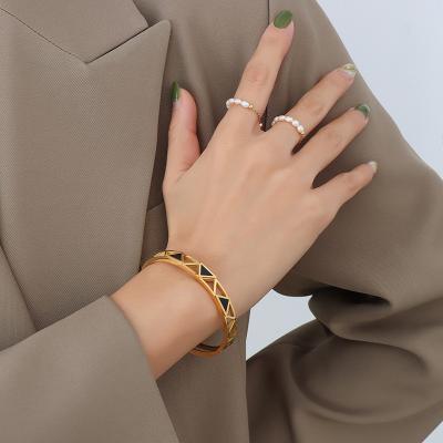 China Fashionable Light TRENDABLE Triangular Hollow Acrylic Luxury Bangle Fashion Noble Style Jewelry Stainless Steel Niche Simple Bracelet for sale