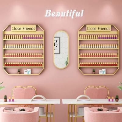 China Popular simple gold beauty shop cosmetics frame nail polish wall rack rack for sale