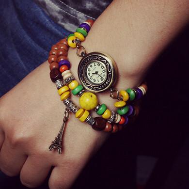 China Retro Style Buddhist Bead Ladies Bracelet Wrist Watches With Eiffel Tower Charm for sale