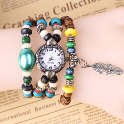 China Het Horloge van de het Leerarmband van analoge Vrouwen/het Houten Horloge van de de Parelarmband   van Boedha Te koop