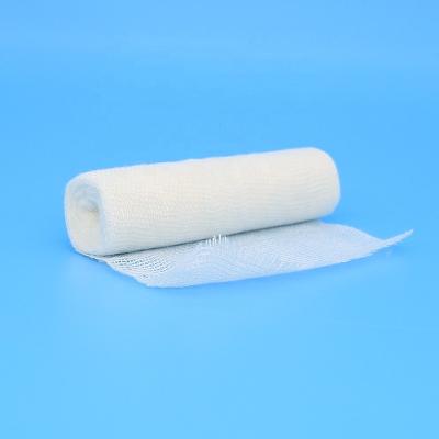 China Manufacturer-Supplier Elastic Breathable Machine Roll Gauze Bandage Viscous With Woven Edge for sale