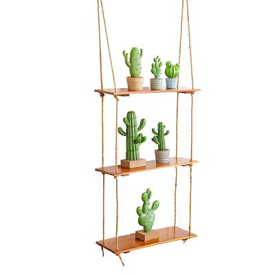 China Stored Unperforated Hemp Rope Solid Wood Living Room Wall Hanging Rack for sale