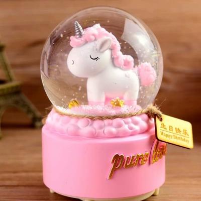 China Christmas gifts from Europe 80mm, handmade glass polyresin musical unicorn snow globe with light for sale