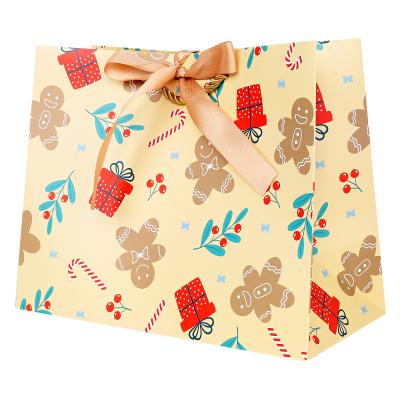 China Wholesale New Design Materials Recycled Custom Print Embossed Christmas Bags For Gift With Ribbon Handle for sale