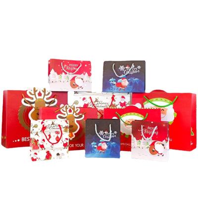 China Recycled Materials Logo Christmas Santa Claus Kraft Custom Square Bottom Gift Paper Bags With Handles for sale