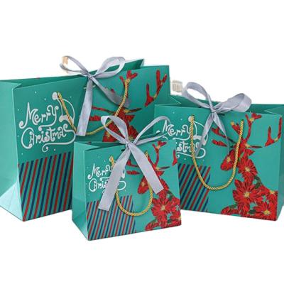 China Recycled Materials Personalization Green Christmas Kraft Paper Bag For Gift Package With Handle for sale