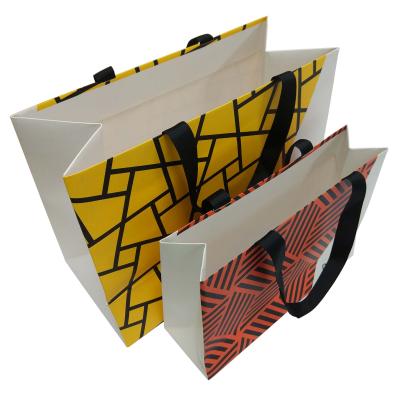 China Recyclable printed paper shopping bag with grosgrain ribbon for sale