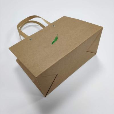 China Recycled Materials Brown Kraft Paper Bag With Green Foil Logo And Paper Rope Handle for sale