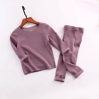 China Vintage baju anak Winter warm and velvet self-heating seamless boys and girls suits, big children's base suit for sale