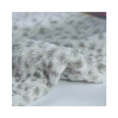 China Favor Price Small Plush Polka Dot Embossed Leopard Dot Rabbit Fur Printed Fabric for sale