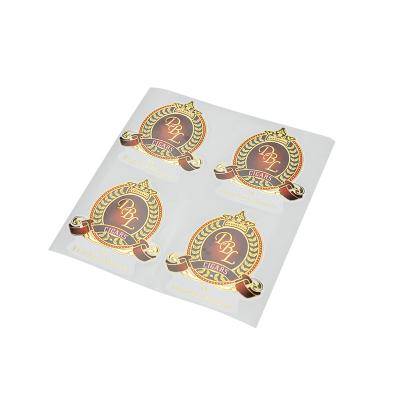 China Waterproof Custom Gold Foil DBL Logo Sticker Embossed Stickers Die Cut Foil for sale