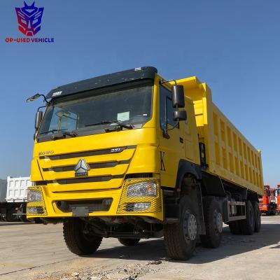 China Howo a7 60 ton heavy duty dump truck with 6 - 8L crane for sale