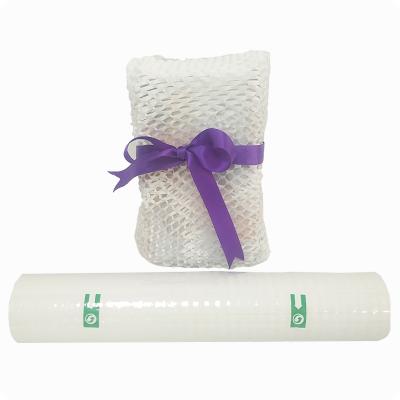 China Recyclable Biodegradable Honeycomb Packaging Paper Roll Coreless Protective Pad Cushioning White Craft Paper Packaging Envelope for sale