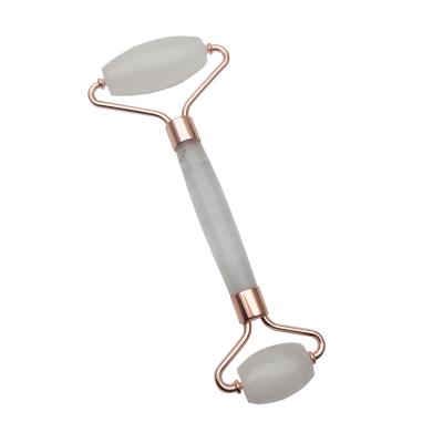 China Lift Skin Rose Gold Metal Clear Quartz Face Roller for sale