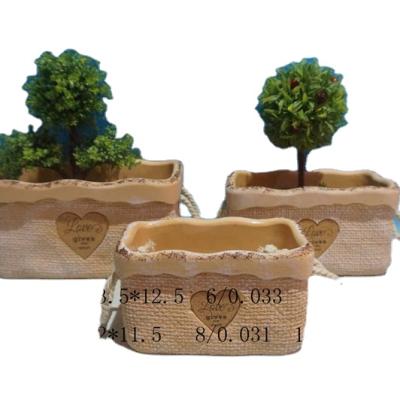 China Creative cartoon jute bag form cement flower pots indoor plant pots outdoor home decoration and garden for sale