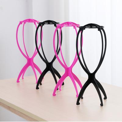 China With Hot Selling 36*17cm Wig Hair Stand Wig Show Plastic Wig Stand Holder Pink White Blue Black Wig Display Racks for sale