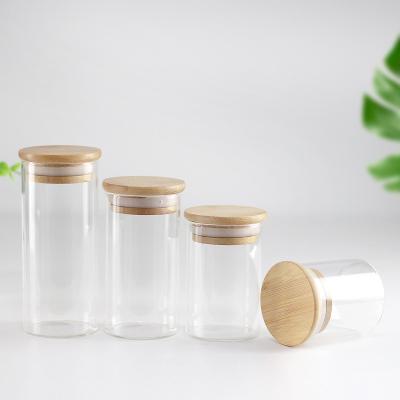 China Gift & Wholesale Craft Logo Customize Clear Round Cylinder 100ml 7oz 10oz Empty Glass Candle Container With Bamboo Lid for sale