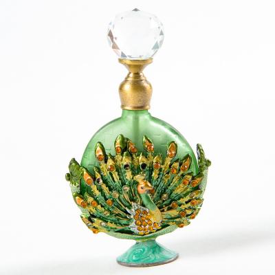 China PERFUME Metal Peacock Perfume Bottle Middle East Metal Perfume Bottle for sale