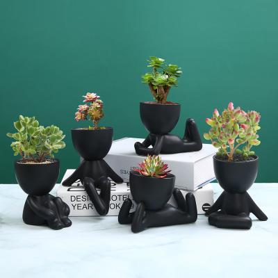 China Creative Hot Pots Desktop Decorative Succulent Plant Cute Amazon Design Human Flower Pots And Planters for sale