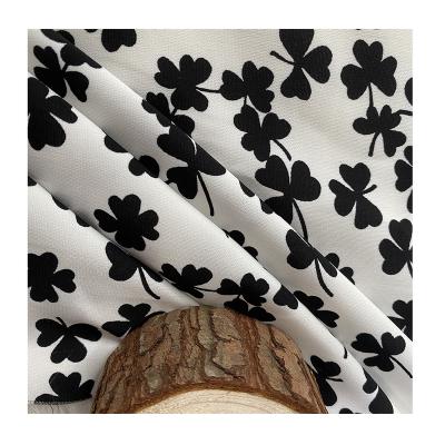 China 2021 pure new fashion four leaf clover 100% polyester pattern printed fabric for making women's garment dress for sale