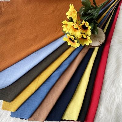 China Hot Sales 165gsm Stretch Material Polyester Woven Solid Dyed Crepe Fabric CEY Stretch Textile For Dress for sale