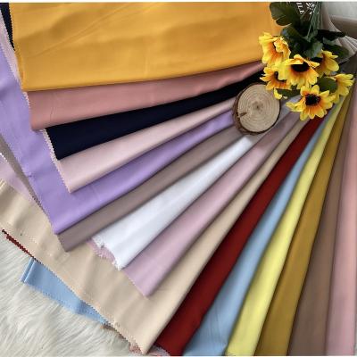 China 100%Polyester Pure Solid Stretch Chiffon 150gsm High Weight Good Quality 100% Pure Silk Fabric For Making Dress for sale