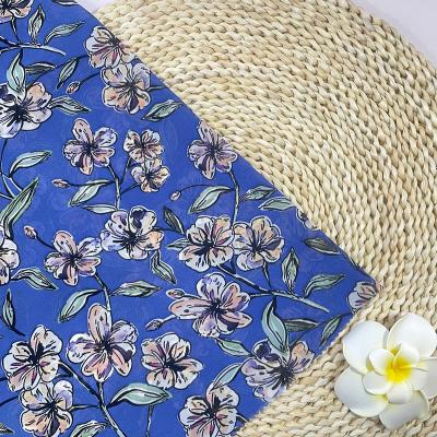 China Hot selling sheer printed flower 90gsm beautiful blue color transparent stock silk chiffon fabric for scarf and apparel for sale