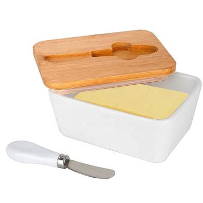 China Sustainable Porcelain Airtight Butter Dish with Bamboo Lid and Stainless Steel Ceramic Knife Butter Container for sale