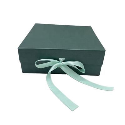 China Recyclable Custom Logo Luxury Cardboard Magnetic Folding Gift Box With Ribbon for sale