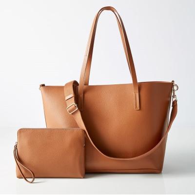 China PORTABLE Pebbled faux PU vegan leather tote bags come with a detachable zipper pocket and an adjustable cross - body strap for sale