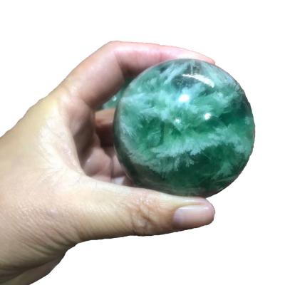 China China wholesale natural crystal snowflake fluorite polished stone crystal ball for healing for sale