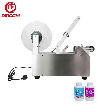 China Semi-automatic Food Round Bottle Labeling Machine Manual Labeler for Wine Bottles Glass Jar Sticker for sale