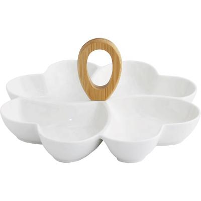 China 4 Grids Amazon Flower Shape Viable Simple White Heart Shape High Temperature Ceramic Fruit Snack Nut Tray With Bamboo Handle for sale