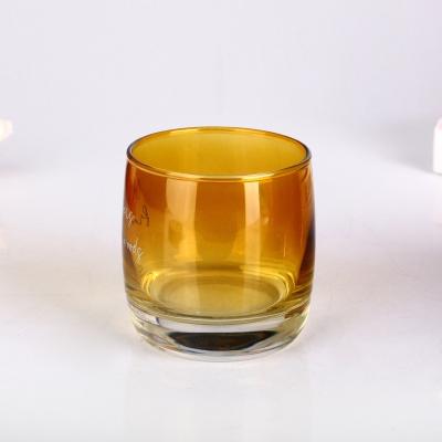 China Thermal Resistance Candle Glass Containers Wholesale Amber Round Shaped Empty Candle Glass Container for sale