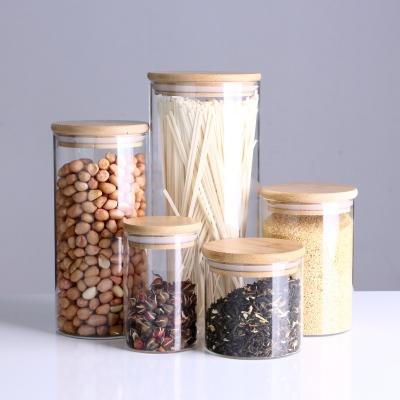 China Modern Kitchen Glass Storage Jar Clear High Borosilicate Glass Food Storage Jar With Bamboo Lid for sale