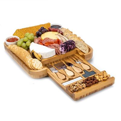 China Sustainable Bamboo Cheese Board Set With Drawer Knives And Bowls Organic Bamboo Cutting Board for sale