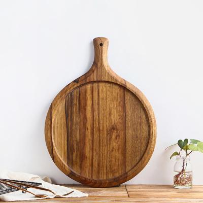 China Viable Good Quality Round Acacia Wood Baked Food Board Cheese Pizza Wooden Cutting Board With Handle for sale